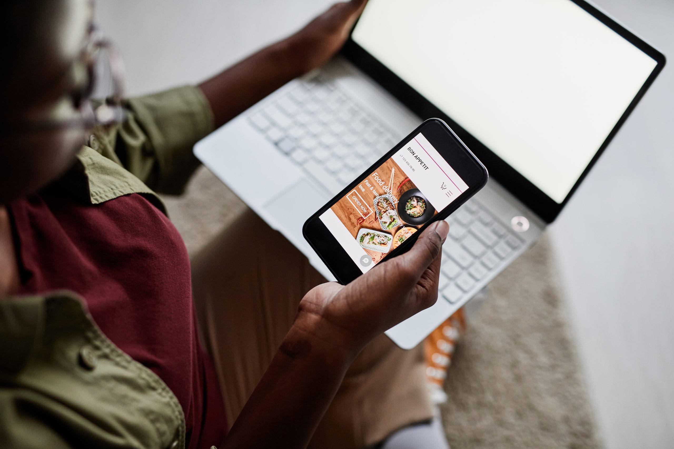 Young Black Woman Using Food Delivery App